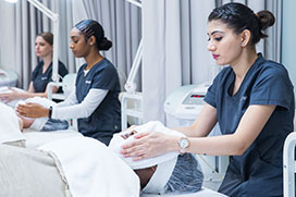 student giving a face massage